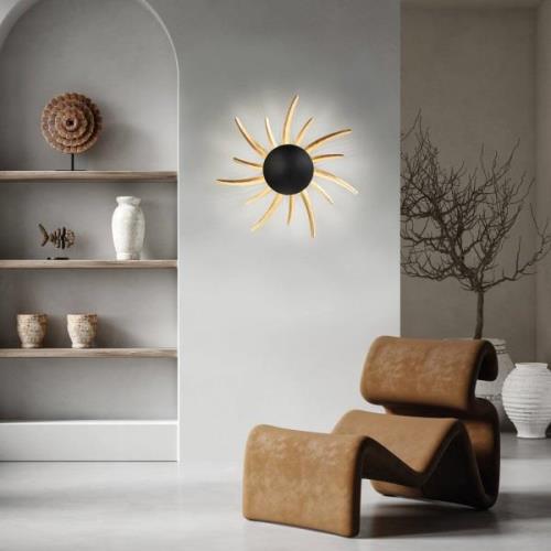 LED wandlamp Sol, zwart met gouden stralen